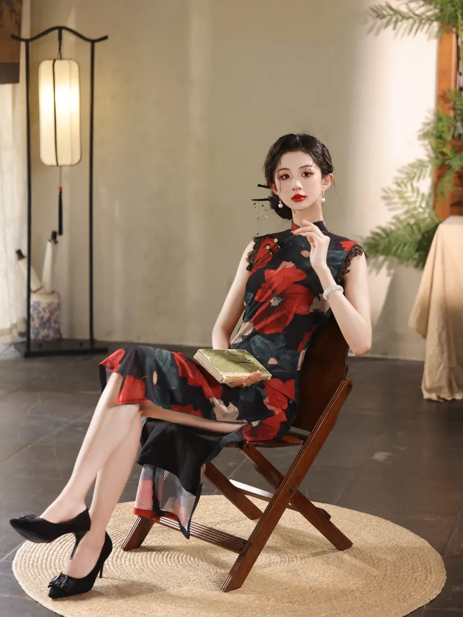 Woman in a Red Black Floral Cheongsam Qipao Dress  sitting on a wooden chair in a room with a lamp and plant.