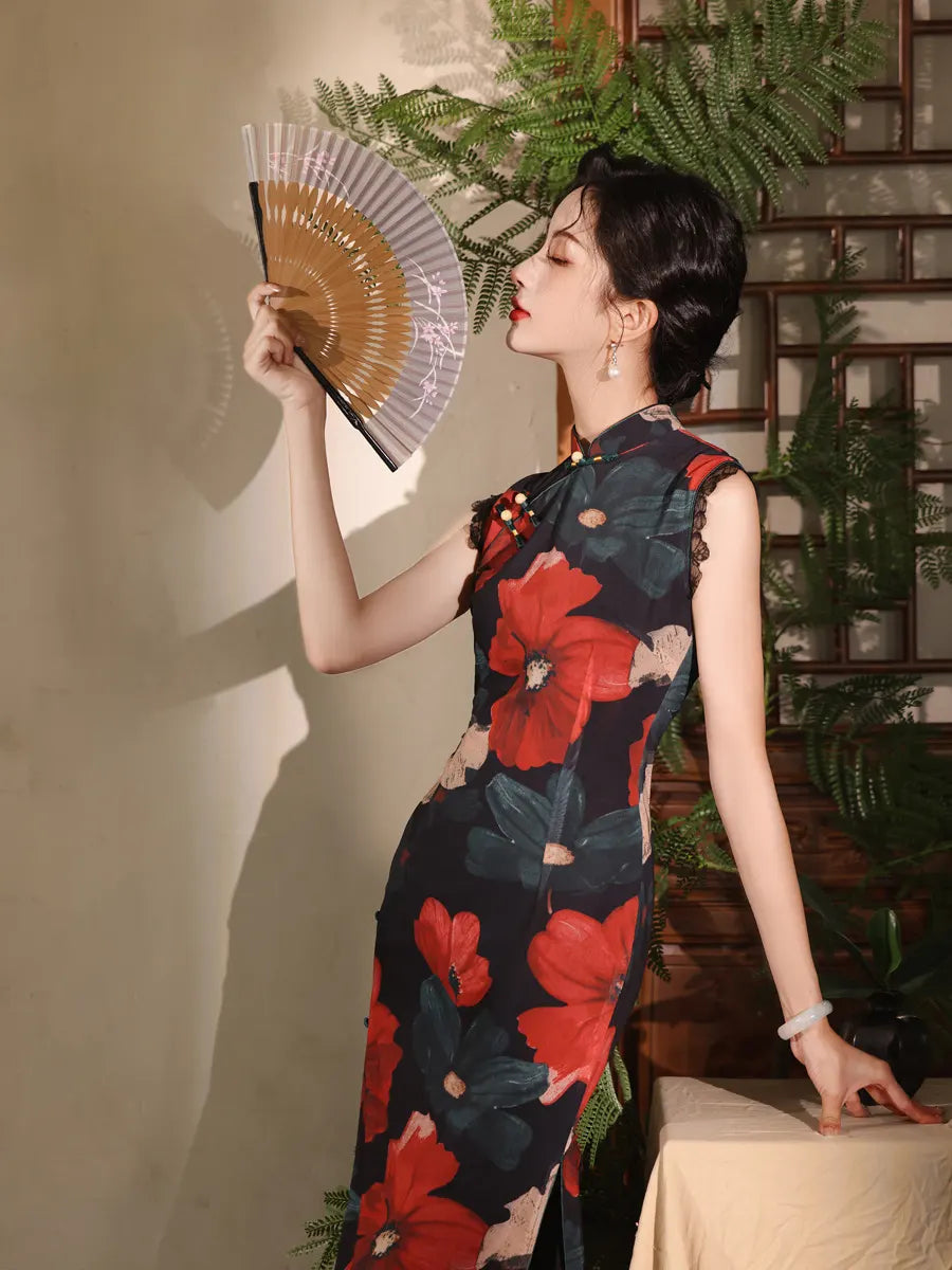 Woman in a Red Black Floral Cheongsam Qipao Dress  holding a fan indoors with plants in the background
