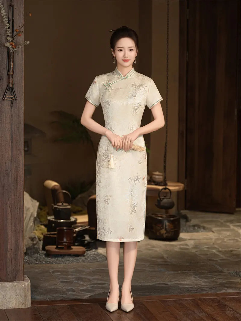 Woman wearing a traditional Chinese Beige Vintage Short Sleeve Midi Qipao Dress  in an indoor setting with wooden furniture.