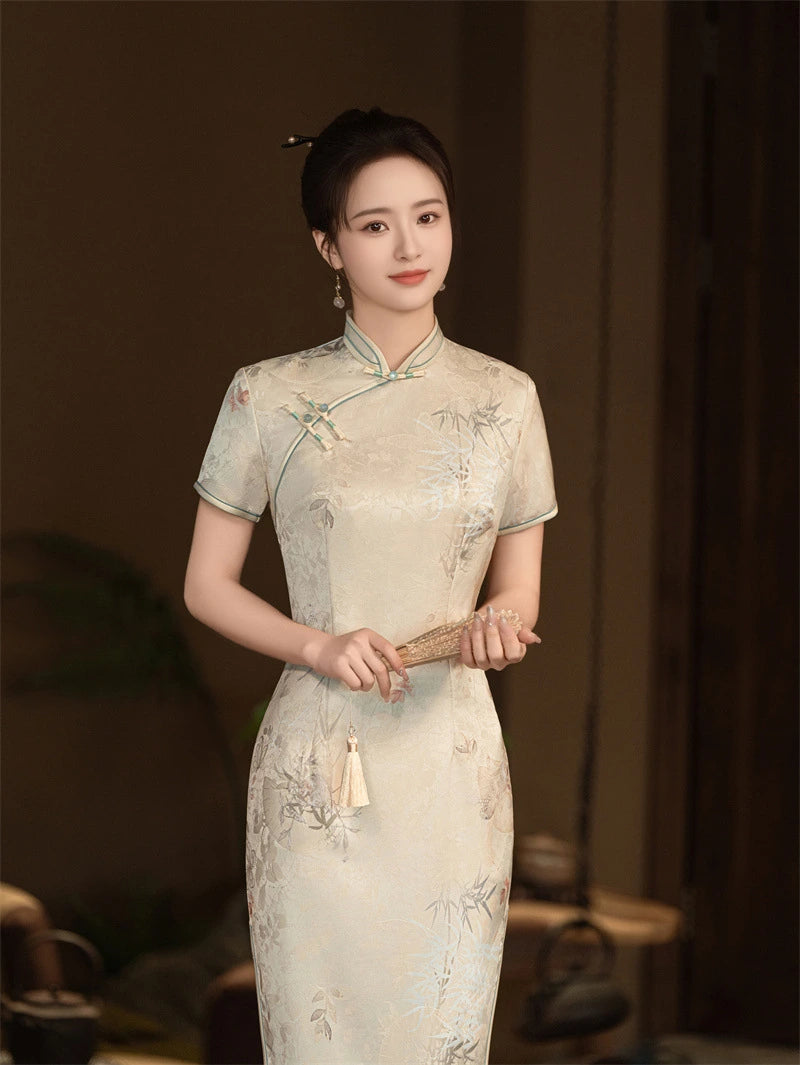 Woman in a traditional Beige Vintage Short Sleeve Midi Qipao cheongsam Dress  holding a fan against a blurred background