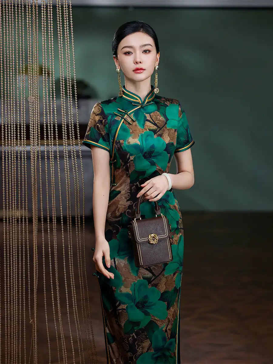 Woman in a Emerald Green Floral Silk Chinese Qipao Cheongsam Dress   holding a handbag in an elegant setting