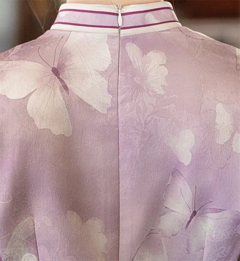 Close-up of a pink garment with butterfly patterns