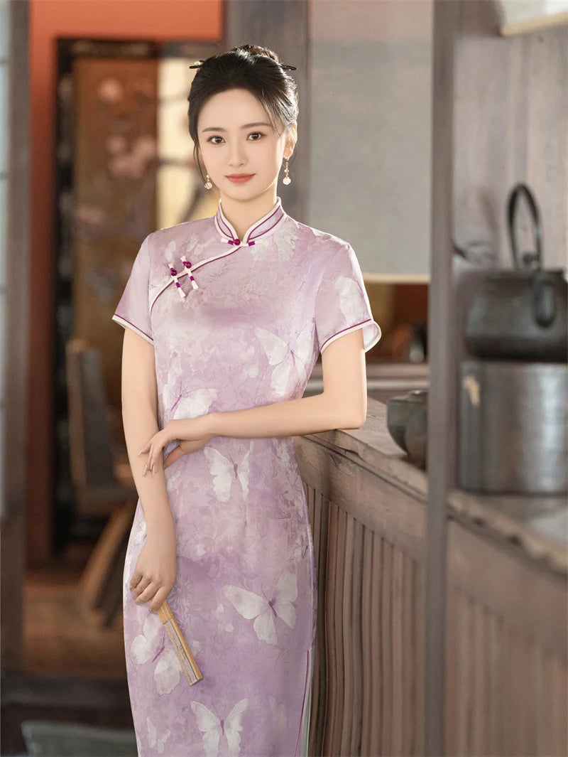 Woman in a traditional Lavender Butterfly Print Midi cheongsam Qipao Dress with floral patterns standing in a kitchen.