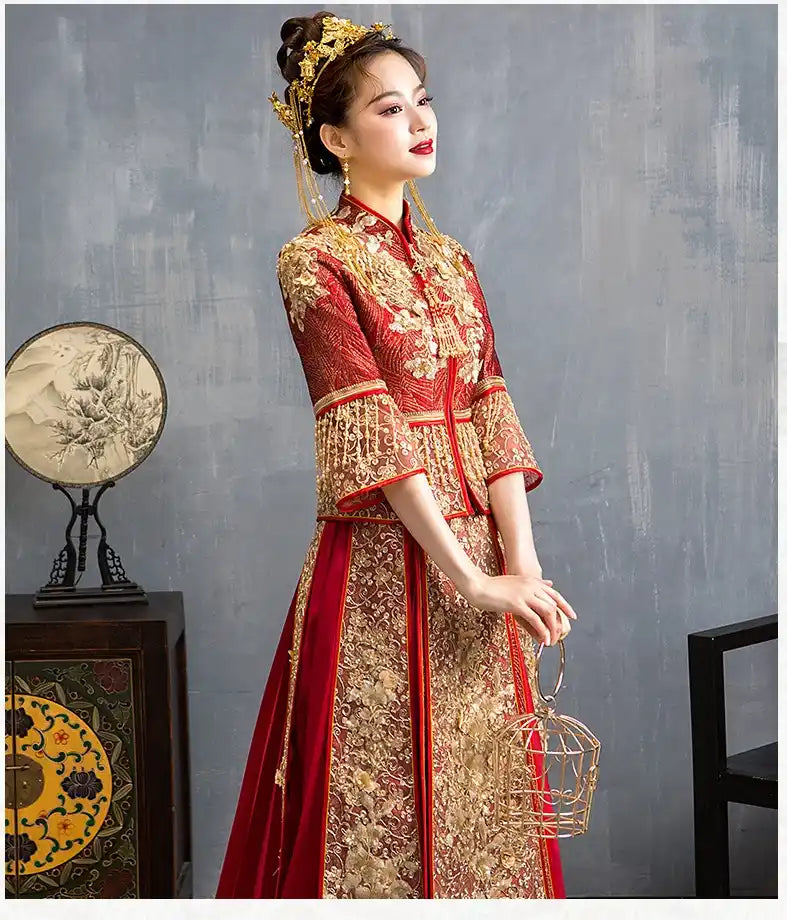 Woman in Red Glittering Qun Kwa Wedding Dress – Traditional Chinese Bridal Attire against a gray background