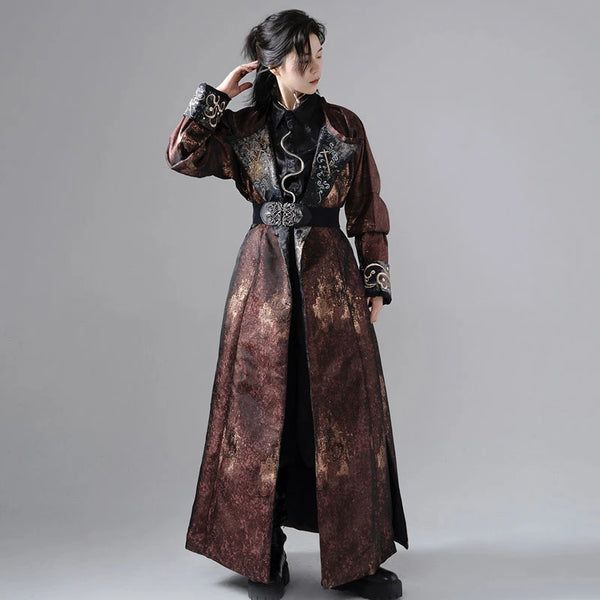 A man wearing a traditional Chinese Hanfu robe with reversible designs, featuring metallic splashes and embroidery on cuffs and lapels.