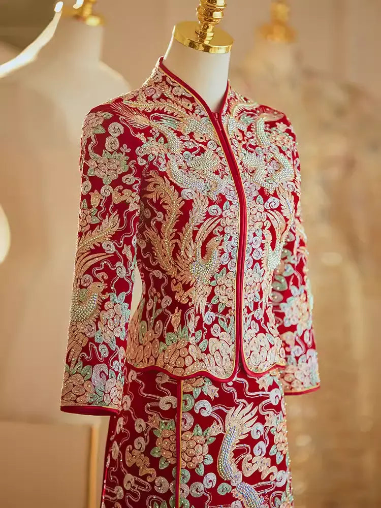 Close-up of intricate gold thread embroidery on a Chinese wedding Qun Kwa jacket