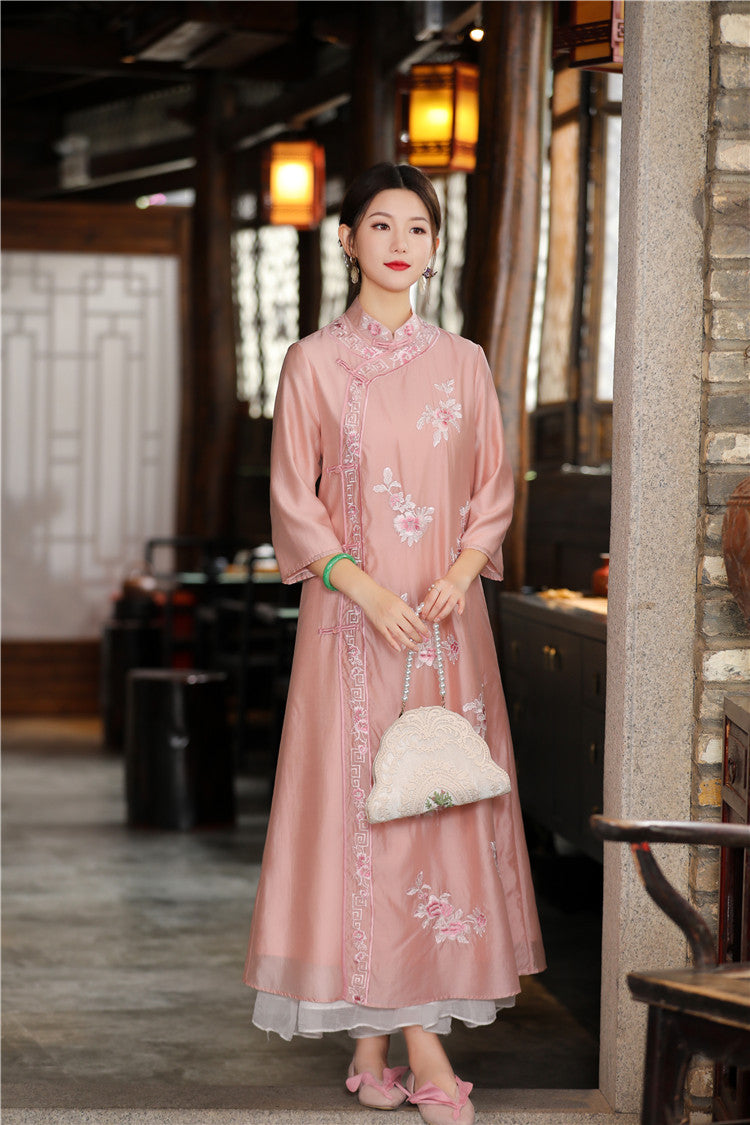 Model in pink floral chinese loose qipao cheongsam dress standing