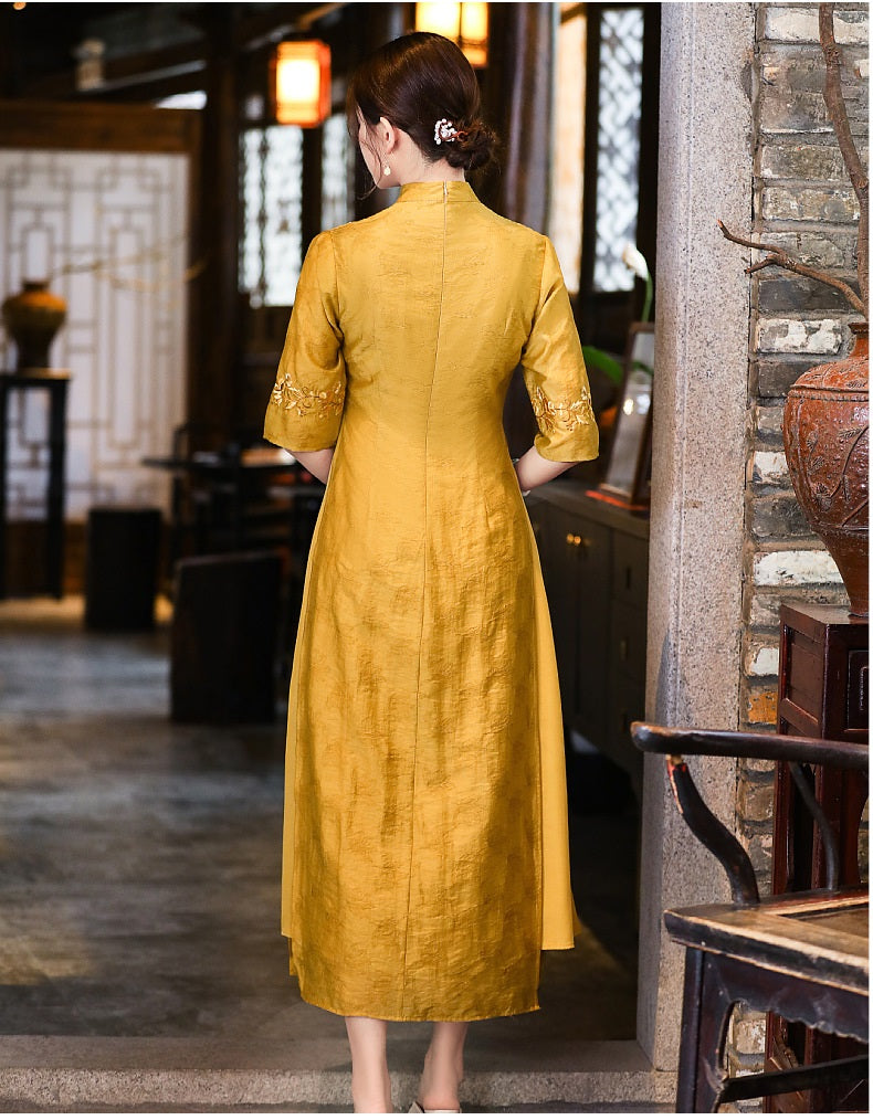 Model in loose yellow floral qipao cheongsam dress back