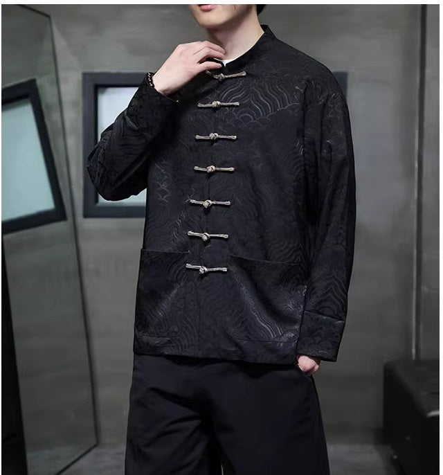 Model in black brocade tang jacket side