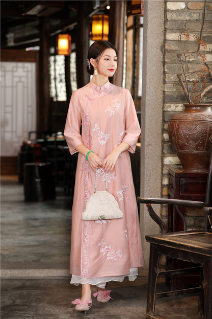 Model in pink floral chinese loose qipao cheongsam dress looking right