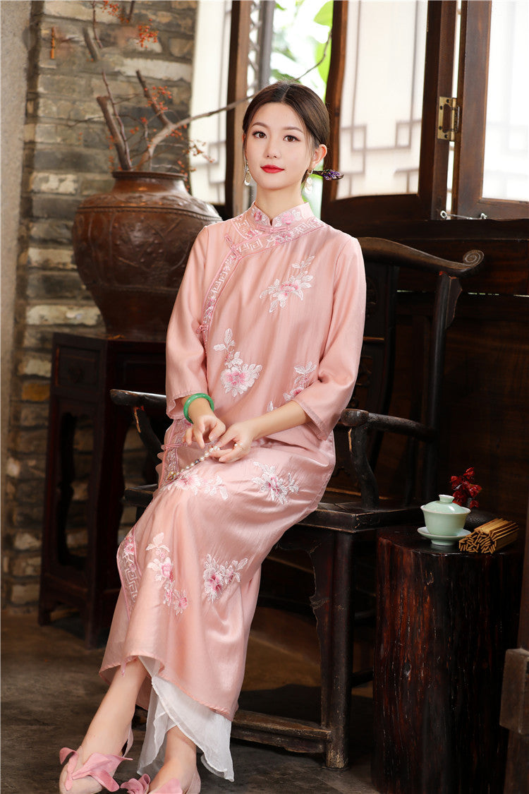 Model in pink floral chinese loose qipao cheongsam dress sitting