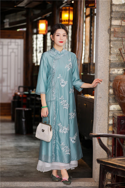 Model in blue floral chinese loose qipao cheongsam dress standing