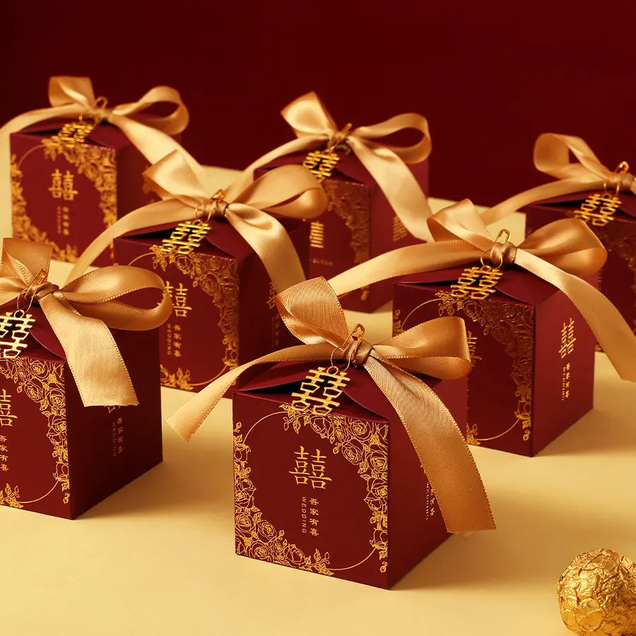 Red & Gold Double Happiness Chinese Wedding Favor Boxes  with gold ribbons on a red background