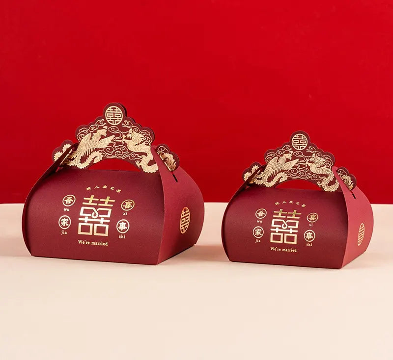 Two red Dragon & Phoenix Double Happiness Chinese Wedding Favor gift Boxes with gold accents on a red background