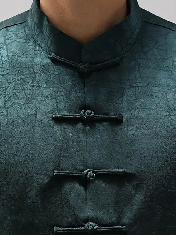 Close-up of a textured green Men's Luxury Mulberry Silk Jacquard Short Sleeve Tang Shirt with button details
