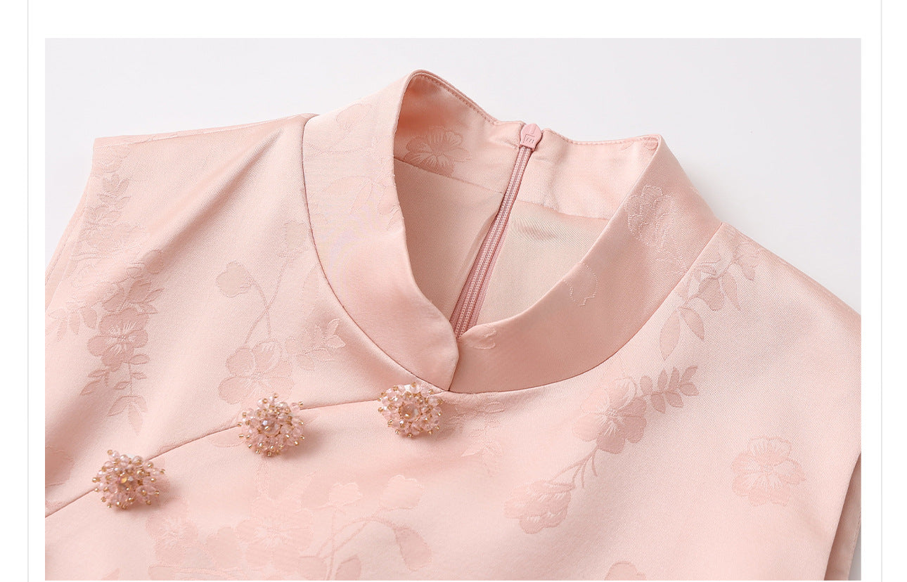 Close-up of a New Chinese Style-Modern Pastel Pink Sleeveless A-Line Mini Qipao with floral embellishments on a light gray background