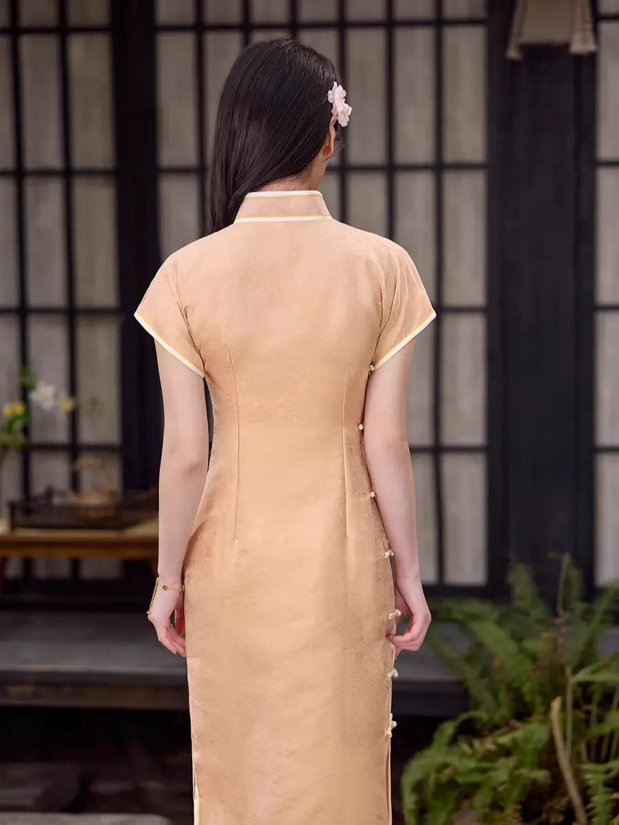 Woman wearing a Peach traditional  Song Brocade Full-Opening  Qipao Dress  in a serene setting