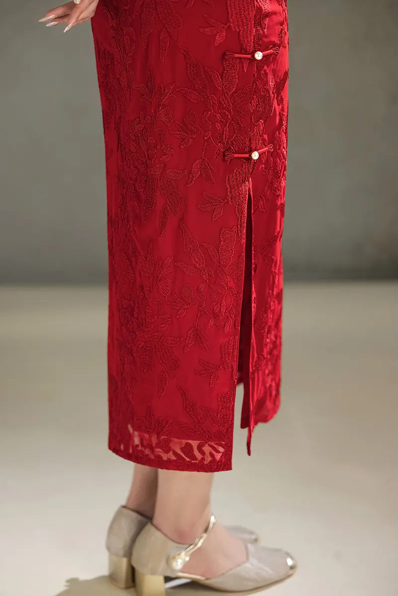 Red embroidered dress with a gray background