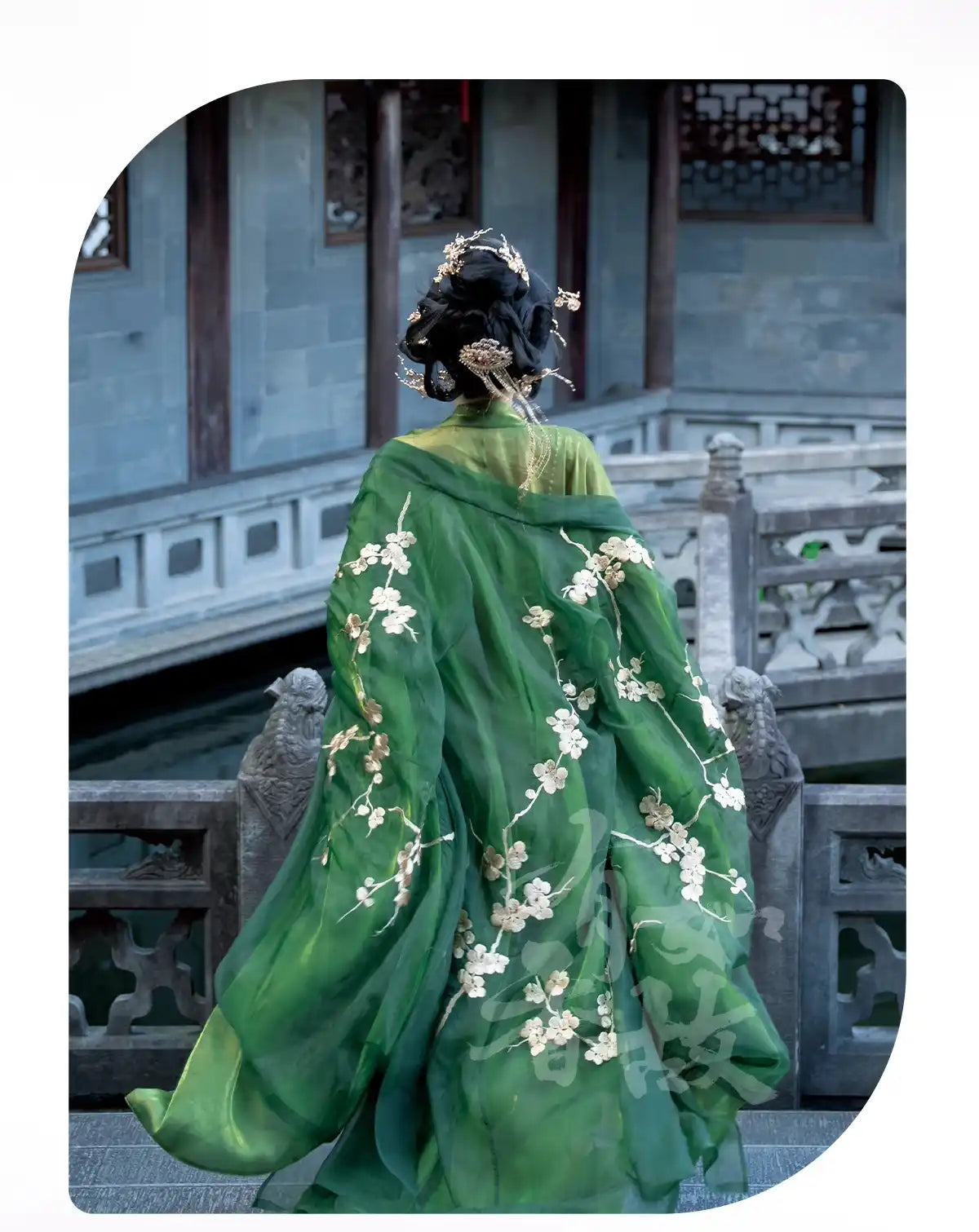 Person wearing a Traditional Chinese Tang Dynasty Green Hanfu Dress outfit with floral patterns in an architectural setting.