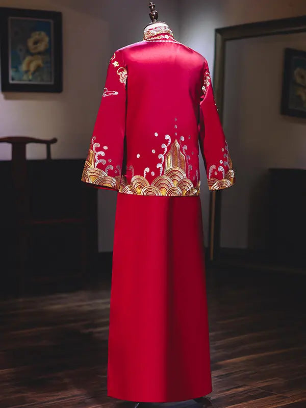 Traditional Red and Gold Double happiness Groom's Tang Suit Gown with gold embroidery on a mannequin against a blurred indoor background