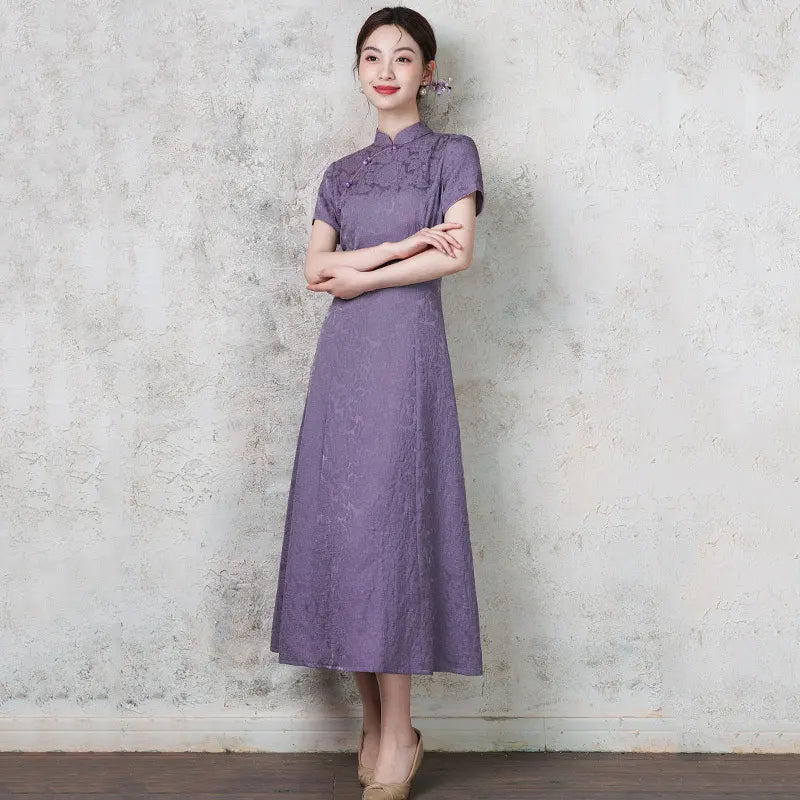 Woman wearing a purple  Short Sleeve Floral A Line Qipao cheongsam against a textured gray wall