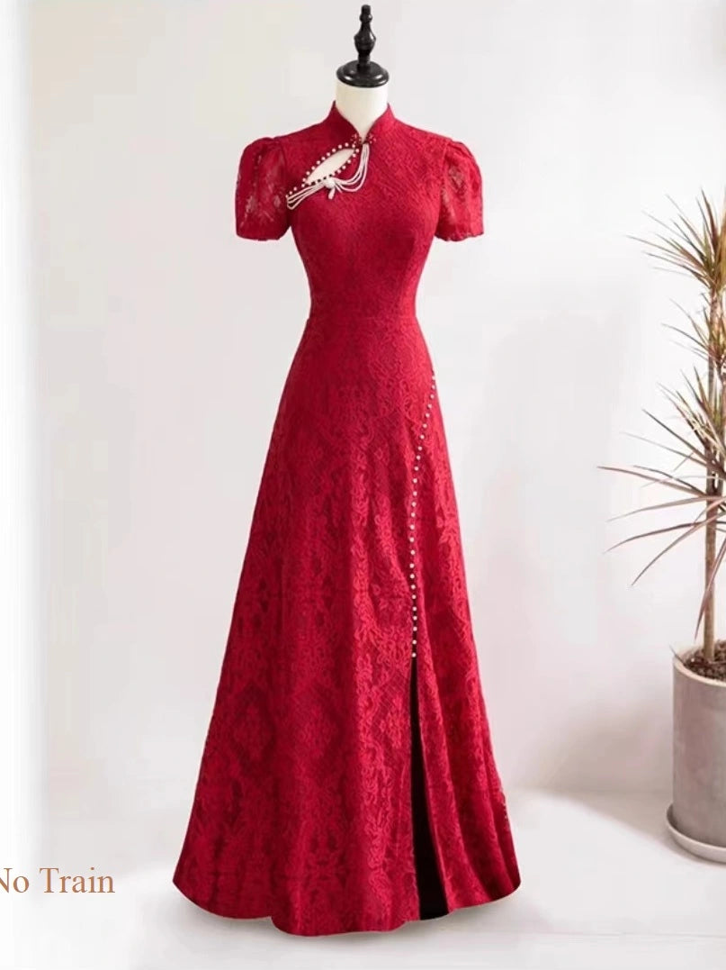 A red Open Back Lace Cheongsam/Qipao Dress With Traindisplayed on a mannequin against a white wall, with a potted plant to the right and a small text overlay reading 'No Train' in the lower left corner.