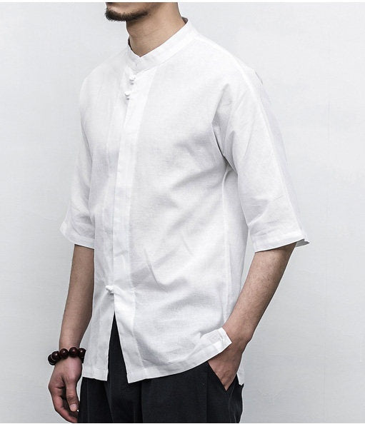 Person wearing a white short-sleeve Men’s Linen Cotton Chinese Mandarin Collar Shirt against a plain background