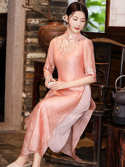 Model in loose pink  floral qipao cheongsam dress sitting