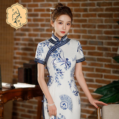 Model in Blue white floral qipao dress standing