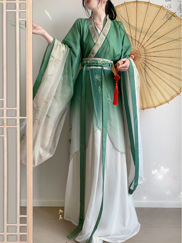 model in green bamboo leaves print hanfu with umbrella