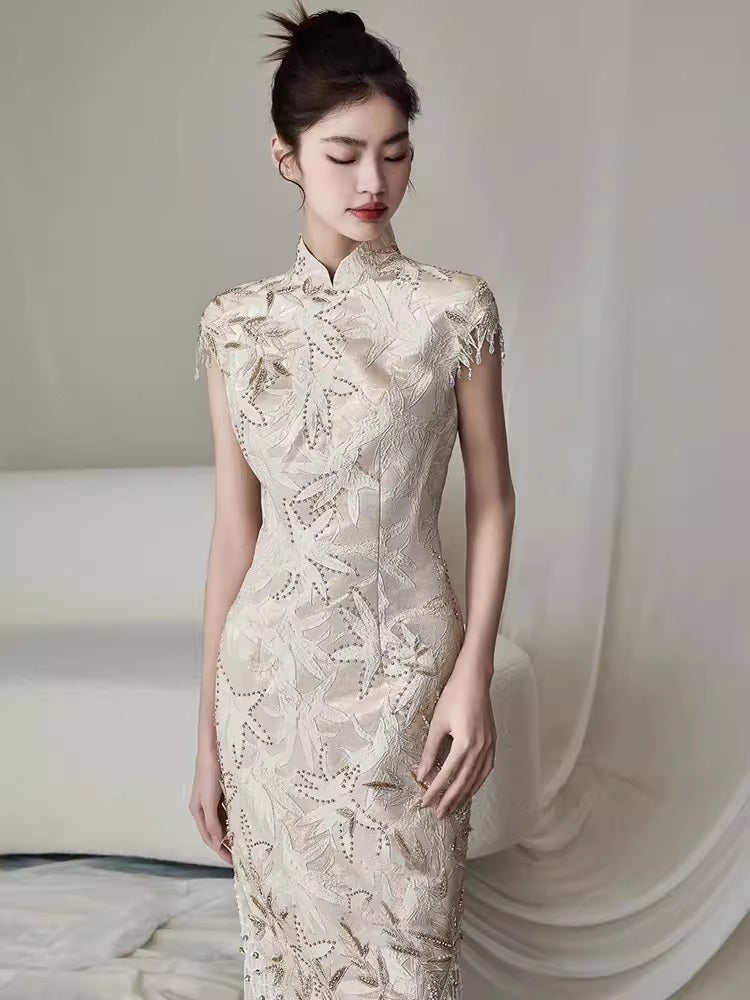 Model in ivory white floral fringe qipao cheongsam dress close up