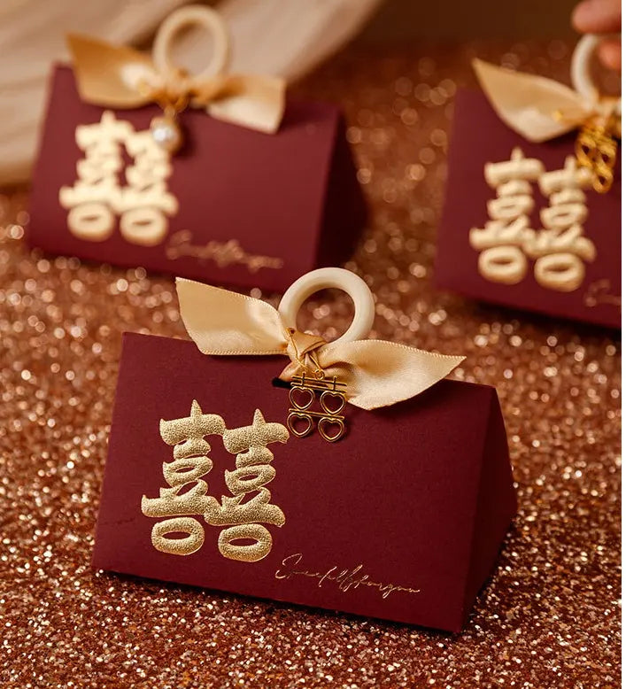 Luxury Gold Foil Double Happiness Favor Boxes for Chinese Wedding gift box with gold accents and Chinese characters on a glittery background