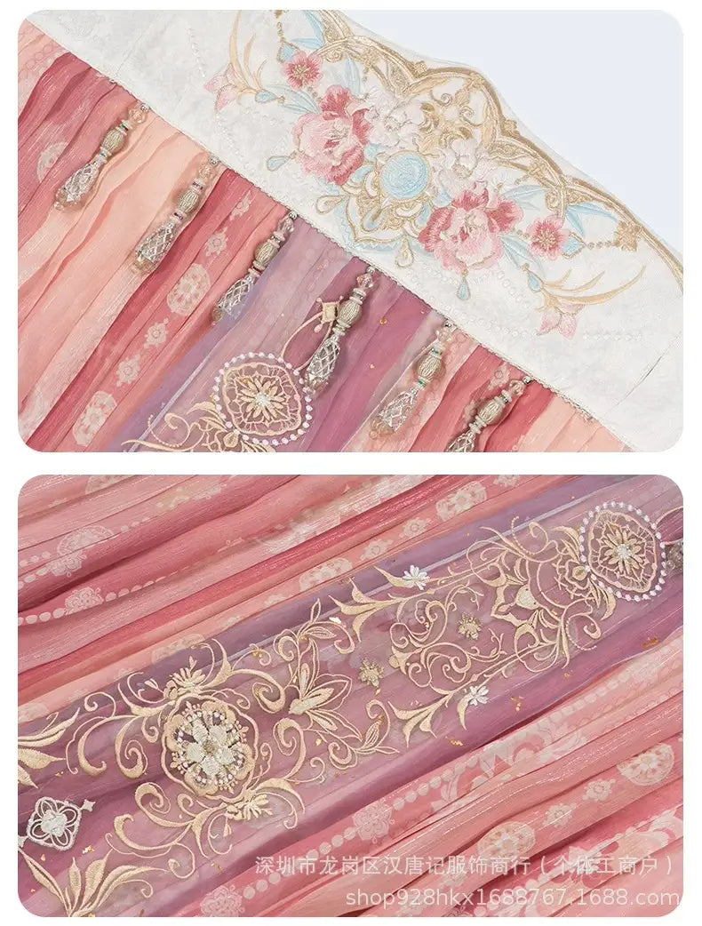 Close-up of pink hanfu fabric with gold embroidery and floral patterns.