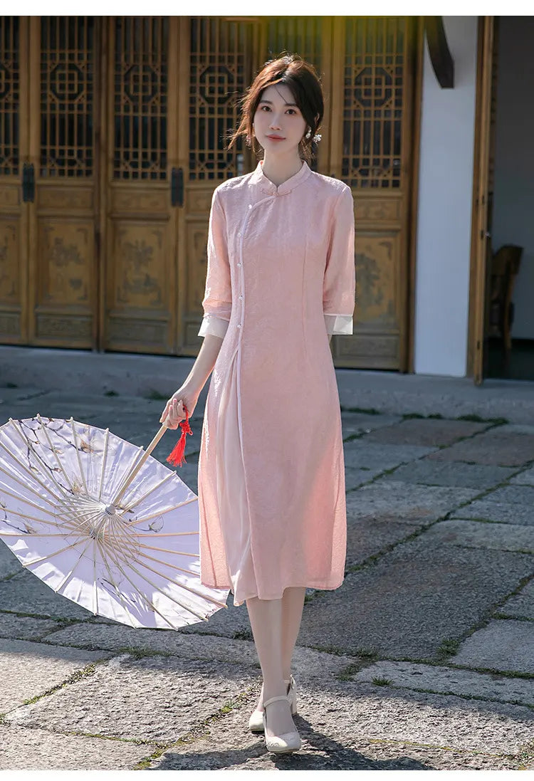 Woman in a pink Loose A Line Cheongsam Qipao Dress holding a white parasol on a stone path.