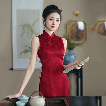 model in red sleeveless qipao cheongsam dress next to a table