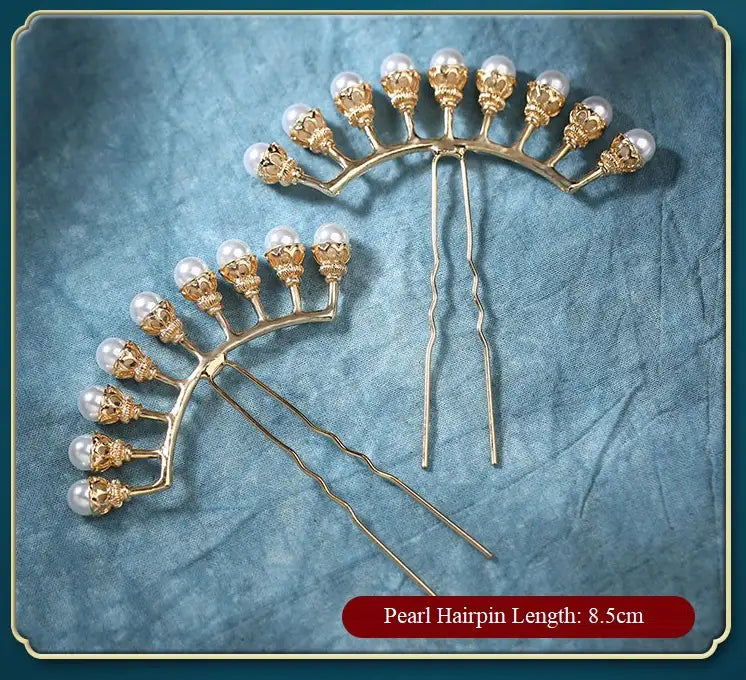 Gold Chinese Wedding Crane Hairpin   with pearls on a textured blue background