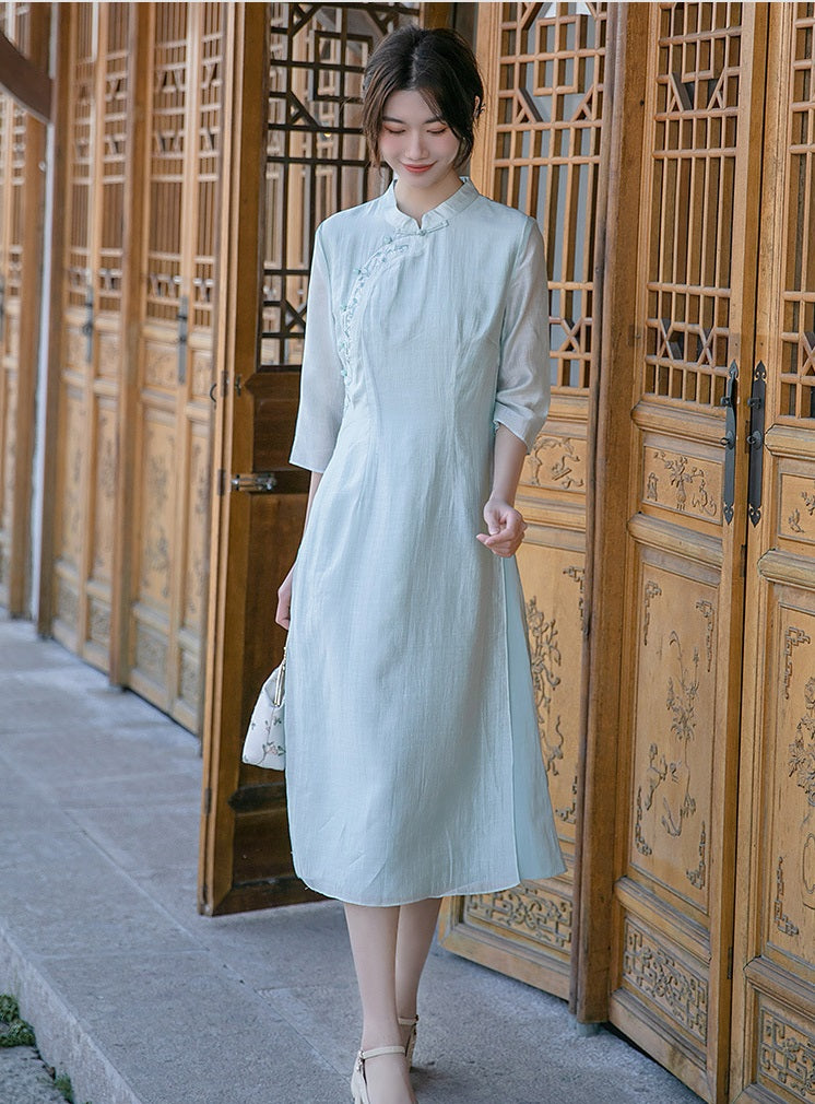 Model in light green loose qipao cheong dress walking