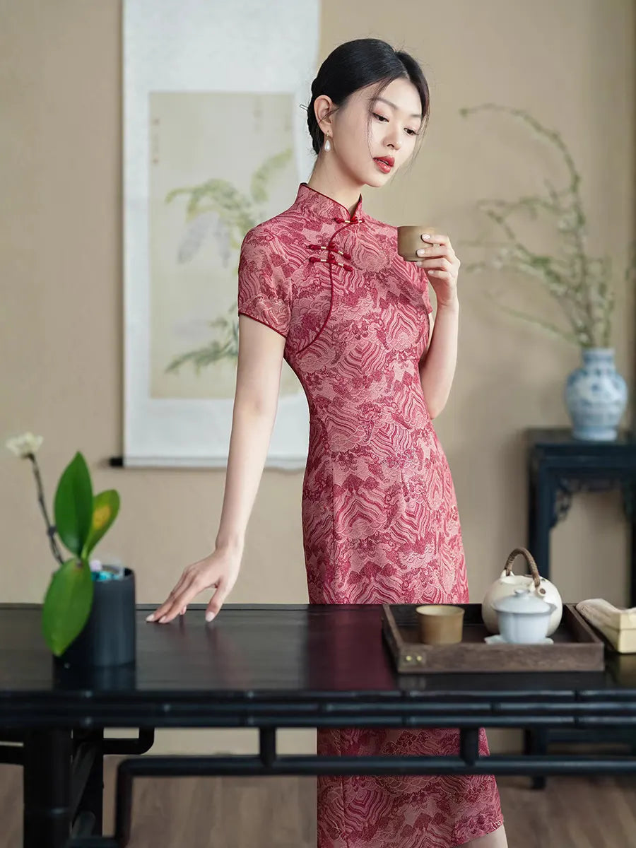 Woman in a Red Short Sleeves patterned  A-Line Qipao Dress  holding a teacup in a traditional setting