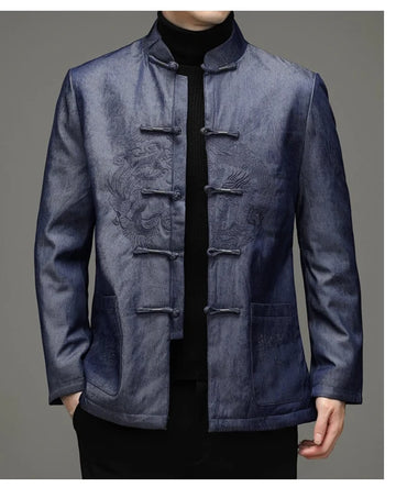 Blue traditional chinese winter goose down tang jacket with dragon embroidered design on a gray background