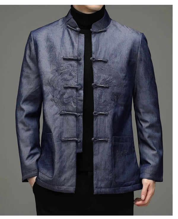 Blue traditional chinese winter goose down tang jacket with dragon embroidered design on a gray background