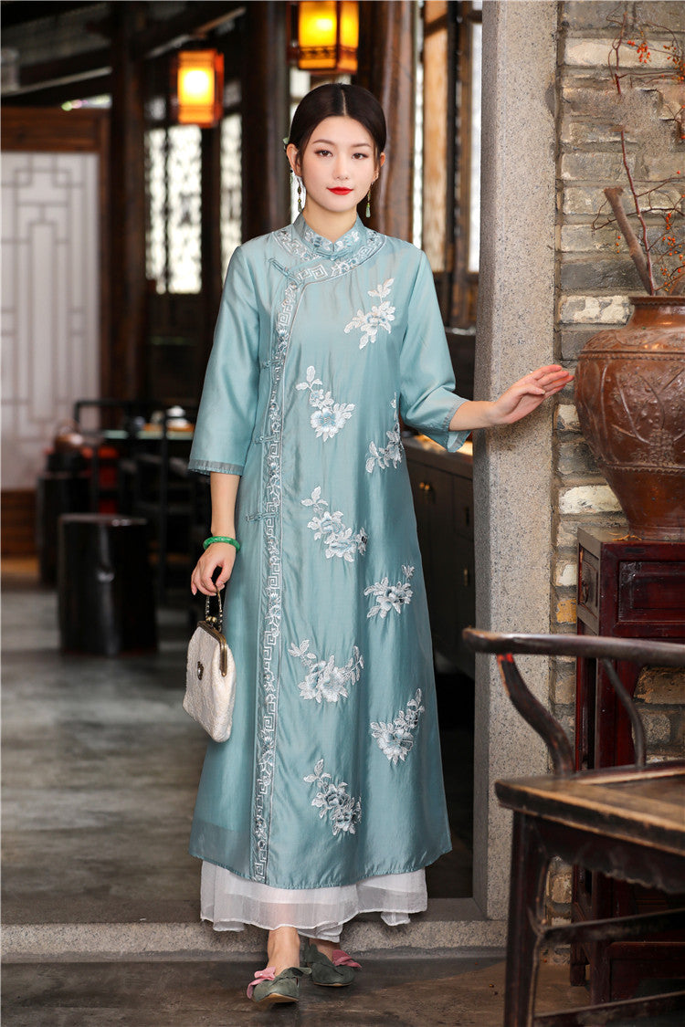 Model in blue floral chinese loose qipao cheongsam dress looking straight