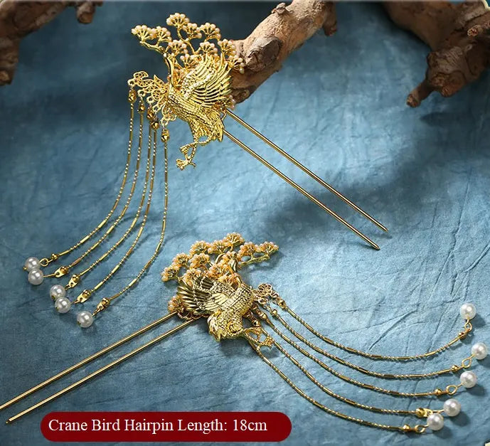Gold Chinese Wedding Crane Hairpin   with decorative elements on a textured blue surface