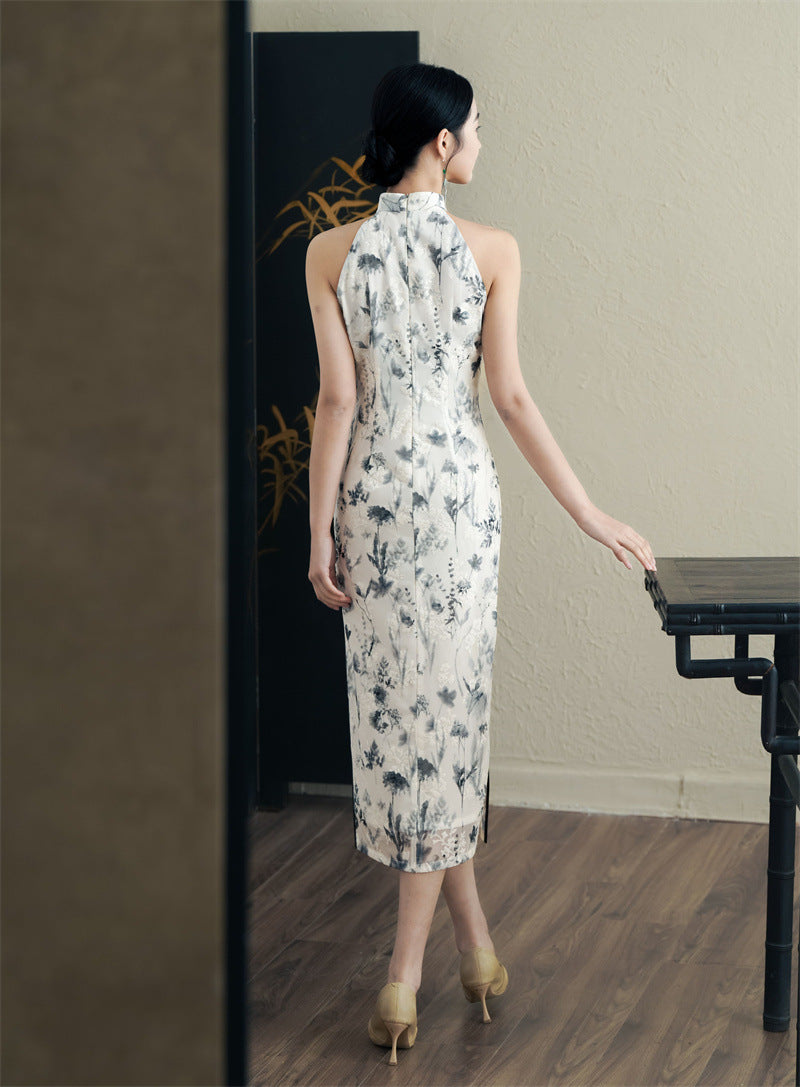 model in black white floral halter neck midi cheongsam qipao dress back