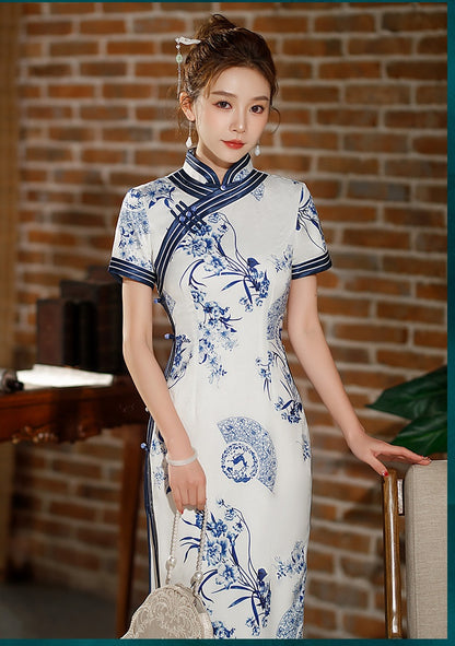 Model in Blue white floral qipao dress standing looking