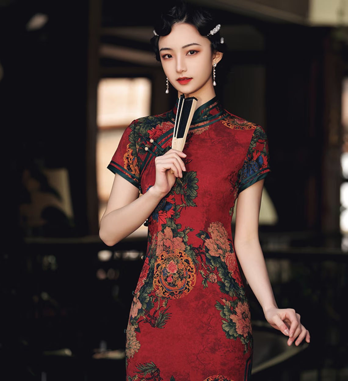 Model in red chinese floral qipao cheongsam dress close up