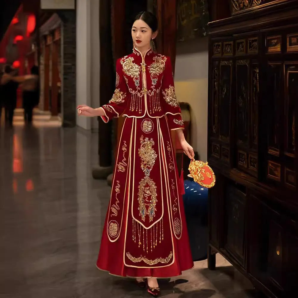 Woman in a Red Qun Kwa – Traditional Chinese Wedding Dress standing in an ornate room.