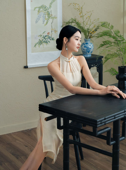 Model in White Halter Neck Qipao sitting