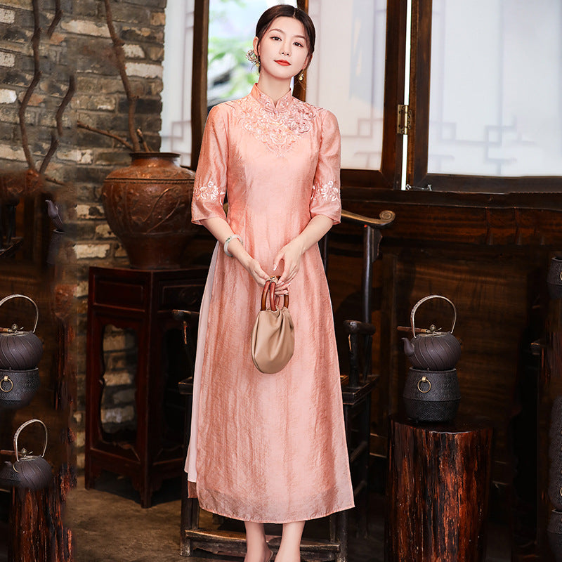 Model in loose pink  floral qipao cheongsam dress looking