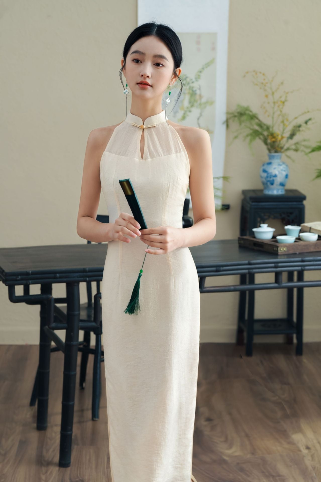 Model in White Halter Neck Qipao looking straight