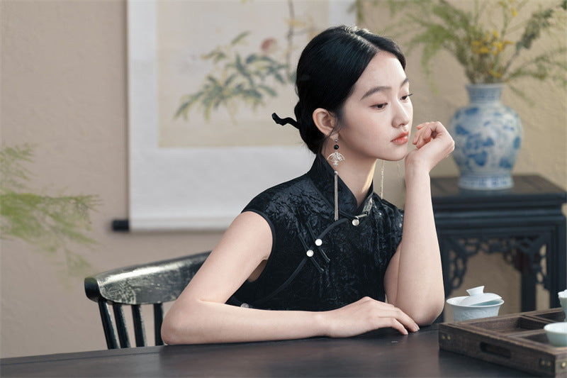 Model in black velvet sleeveless qipao cheong dress thinking